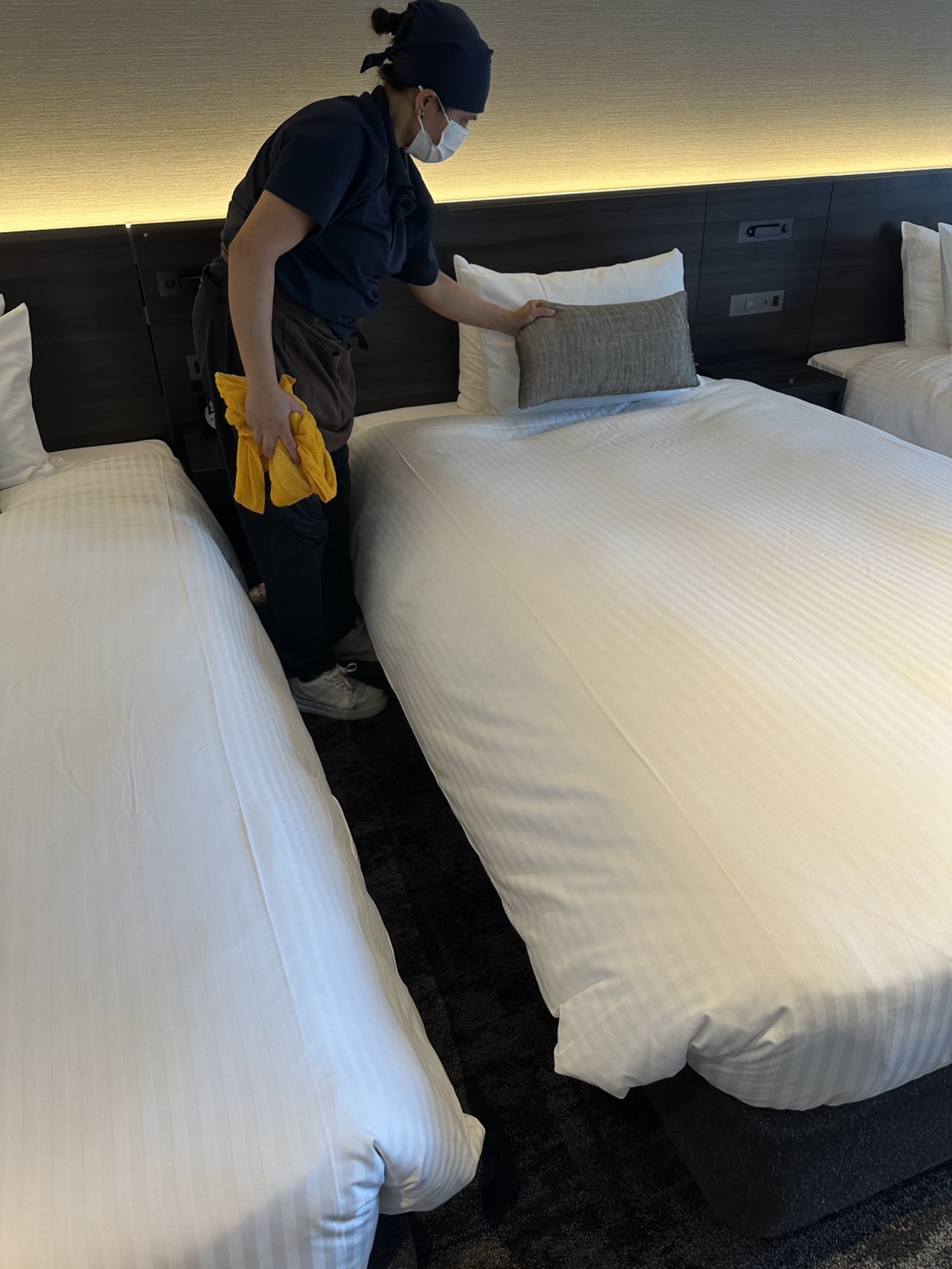 TOYAS staff completing a hotel bed inspection